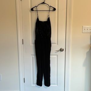Express Black Sequined jumpsuit with front snap closure. Size 0